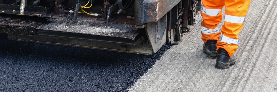 asphalt overlay being applied to a milled road